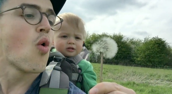 Dad is about to blow on the flower, but the reaction of his son takes him by SURPRISE!
