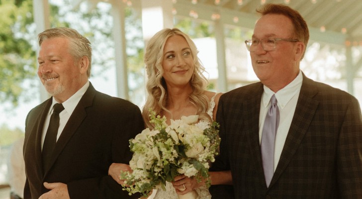 Father walks his daughter down the aisle: he stops halfway to invite her stepfather to join them