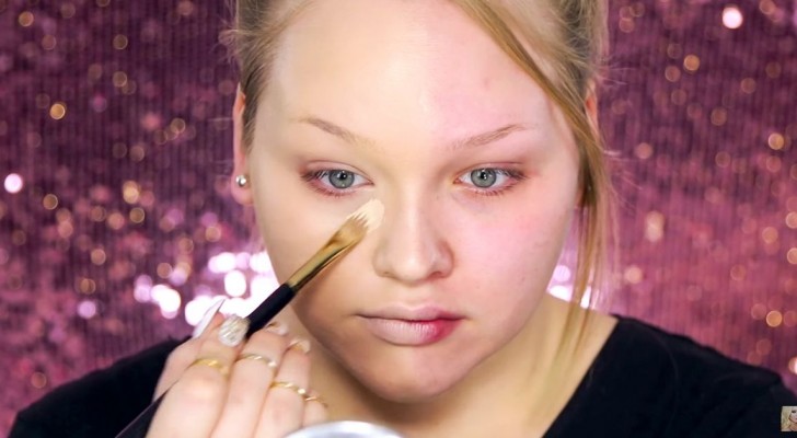 She starts by doing half of her face: The final result will leave you speechless.