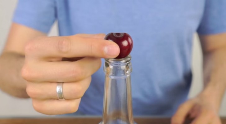He puts a cherry on a bottle. The next step? Try it now!