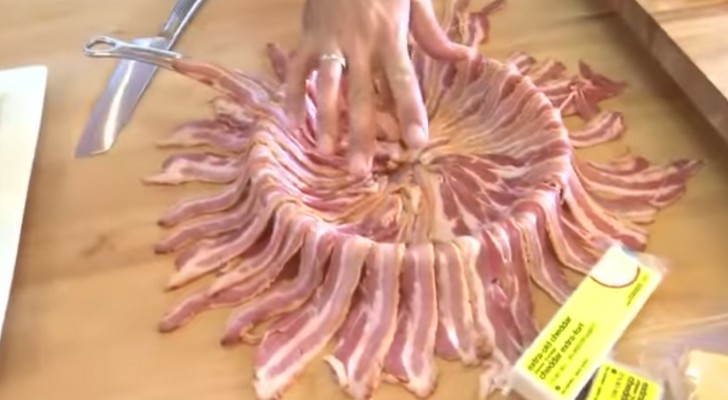He covers the entire pan with bacon ... The next step is mouth-watering!
