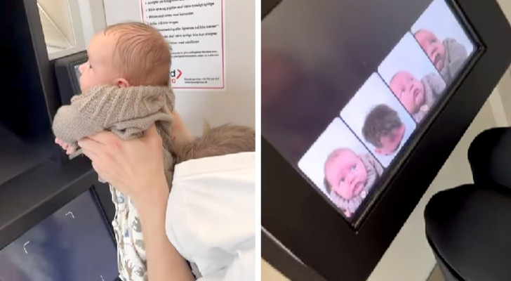 Zwei Eltern versuchen, ihr Baby in der automatischen Fotokabine zu fotografieren