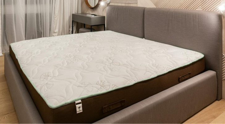 A well-furnished bedroom with a high-quality mattress: periodic rotation extends its lifespan and creates a healthier, more comfortable sleeping environment