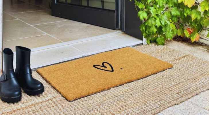 a doormat placed outside the open entrance to a home