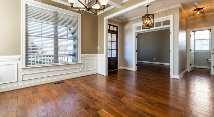 An empty house with a wooden floor