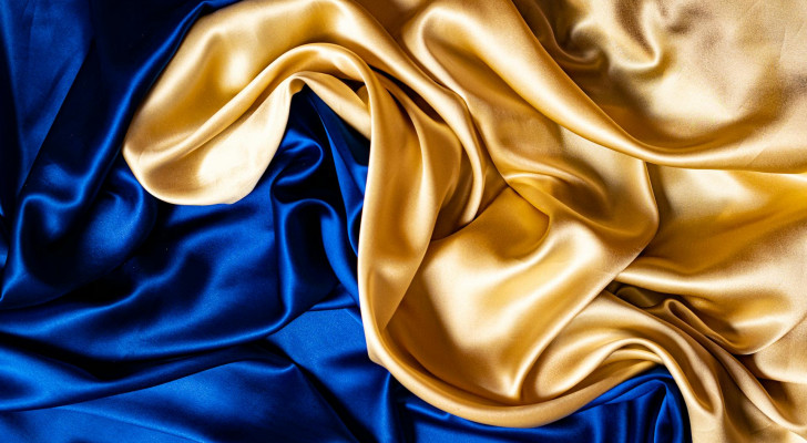 Close up of a gold and blue silk sheet