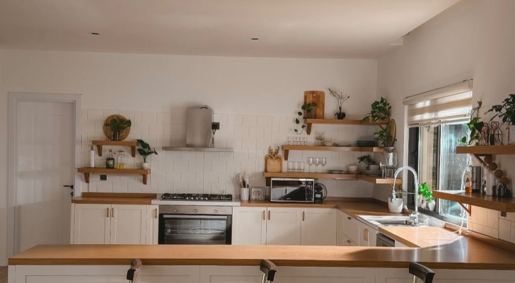 A kitchen with bamboo shelves, countertop and racks