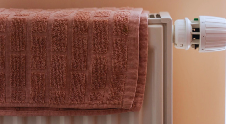 A radiator with a towel on top