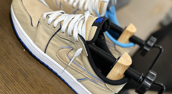 A pair of sneakers with a shoe stretcher inside them