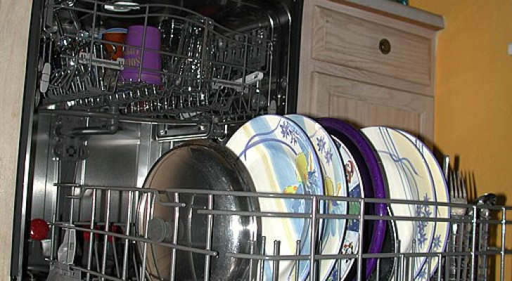 A loaded dishwasher at the end of a wash cycle