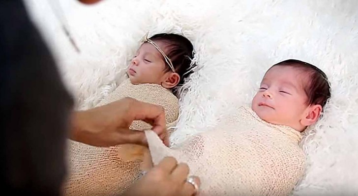 A mother lovingly photographs her newborn twin girls! The captured moments are unforgettable!