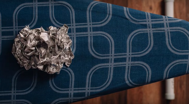 Put aluminum foil on your ironing board --- a money and time-saving trick!