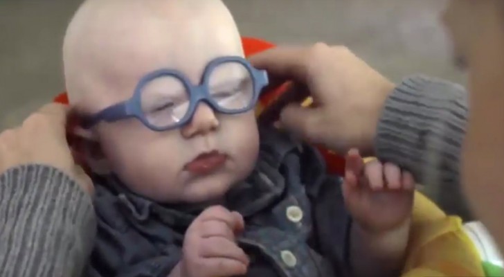 Thanks to special glasses this baby sees his mother for the first time -- this tableau warms the heart!