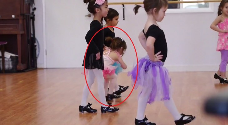 A little girl attempts to follow the dance class --- her tenacity will amaze you!