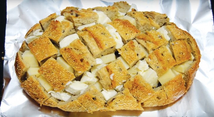 Put pieces of cheese into a loaf of bread -- the result is mouth-watering!